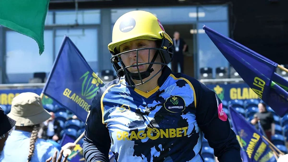 Cricketer from Glamorgan walking onto the field Cricketer from Glamorgan walking onto the field