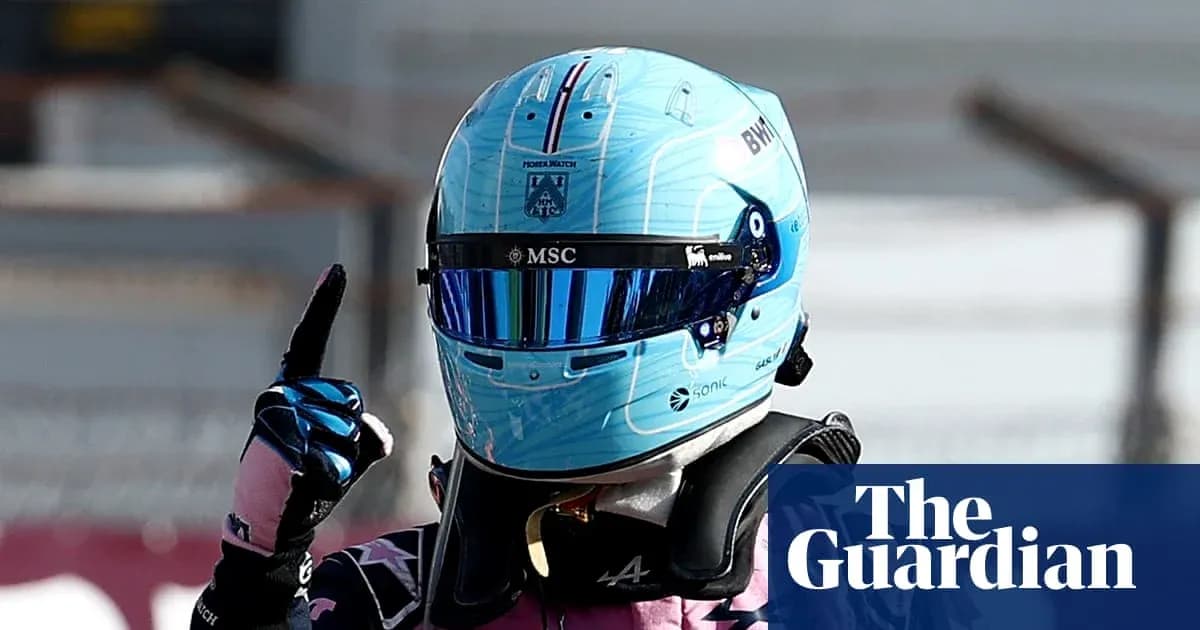 Racing driver celebrating with a raised finger Racing driver celebrating with a raised finger
