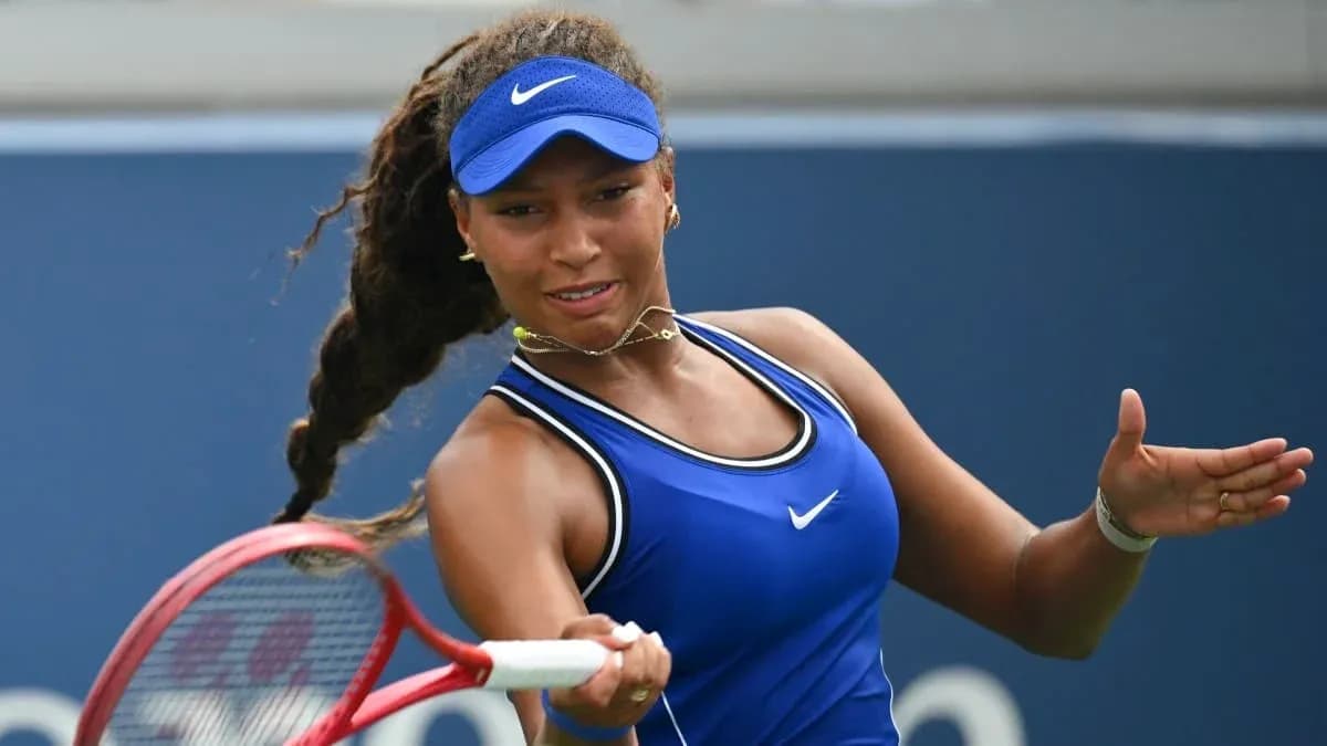 Tennis player hitting a backhand during match Tennis player hitting a backhand during match