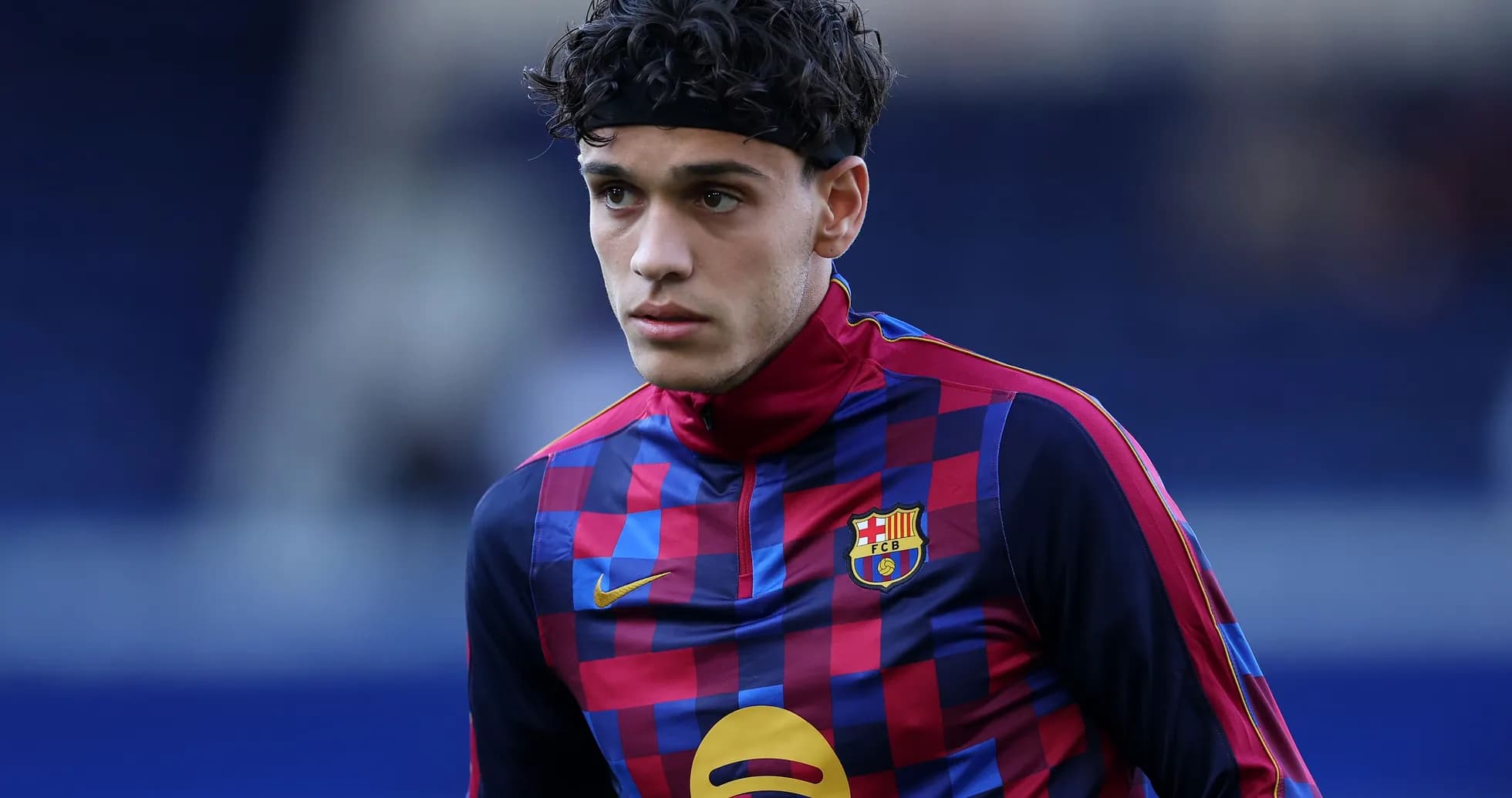 Player wearing FC Barcelona training kit on pitch Player wearing FC Barcelona training kit on pitch