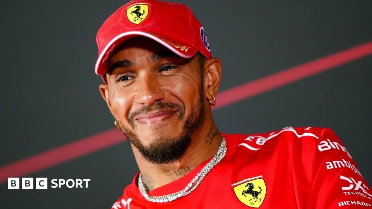 Driver smiling while wearing Ferrari team uniform Driver smiling while wearing Ferrari team uniform