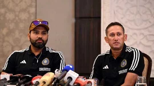 Two cricket team officials at press conference Two cricket team officials at press conference