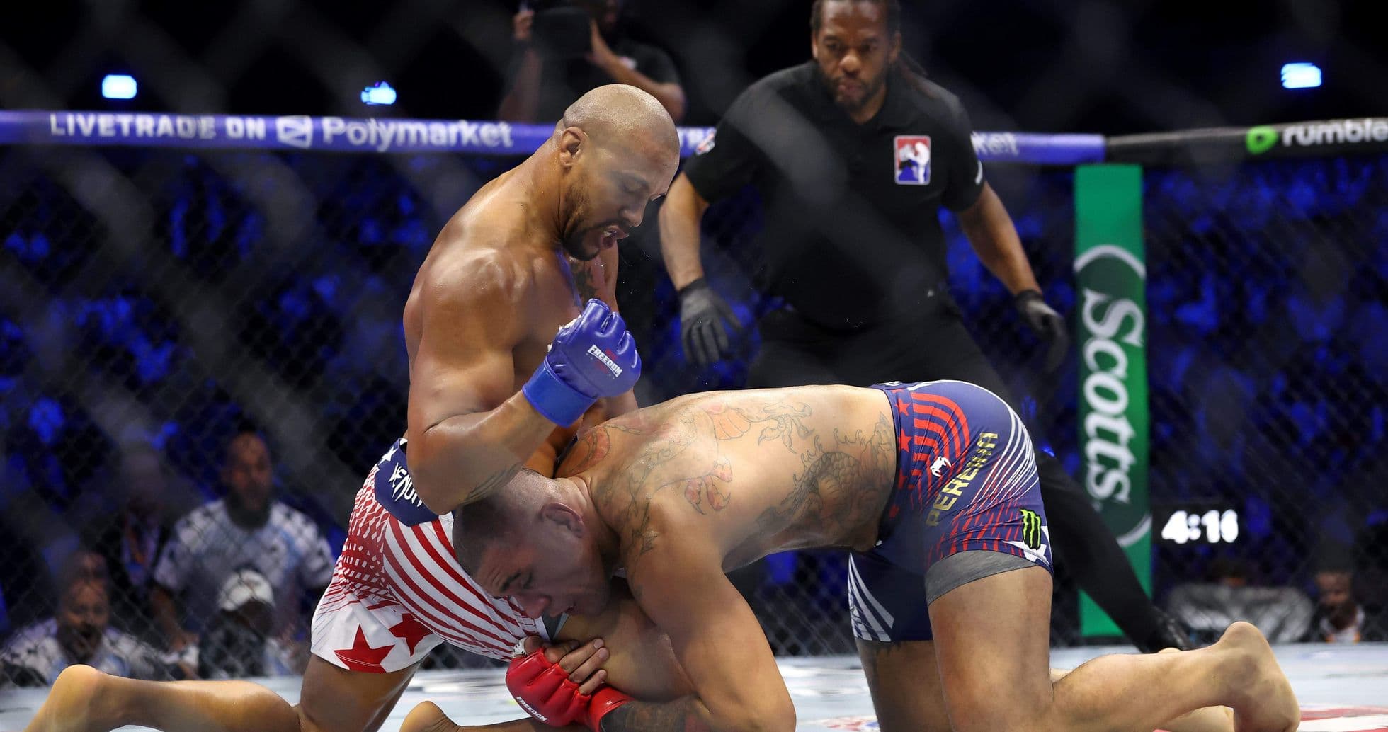 Fighters grappling in an MMA match inside the octagon Fighters grappling in an MMA match inside the octagon