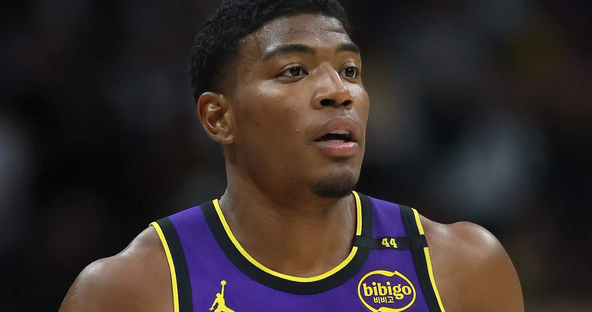 Player in Lakers jersey during basketball game Player in Lakers jersey during basketball game
