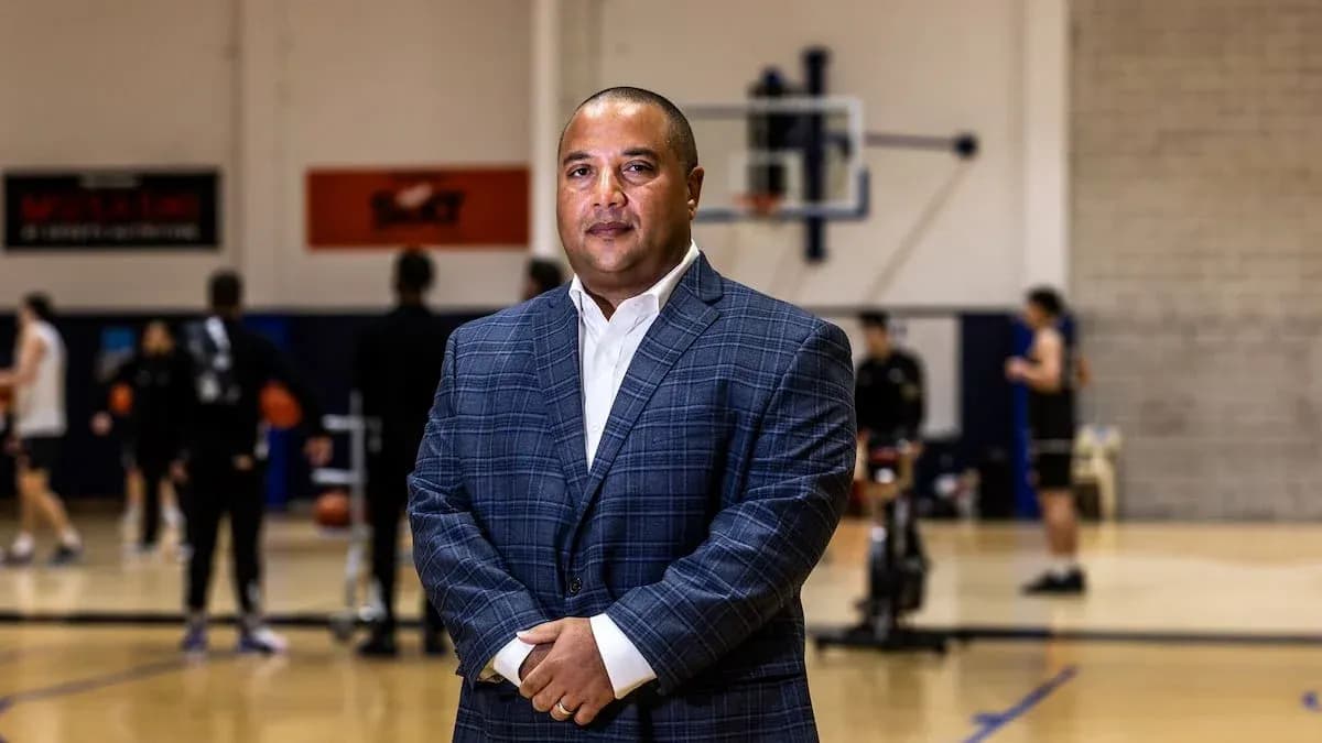 Coach posing on basketball court during practice Coach posing on basketball court during practice