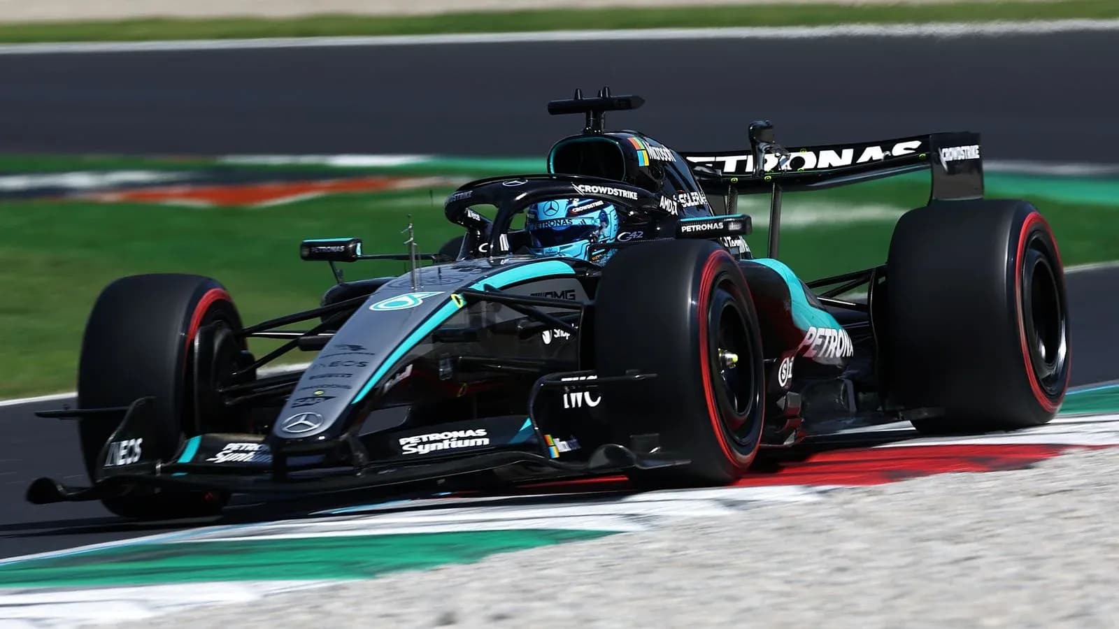 Mercedes F1 car racing on track during event Mercedes F1 car racing on track during event