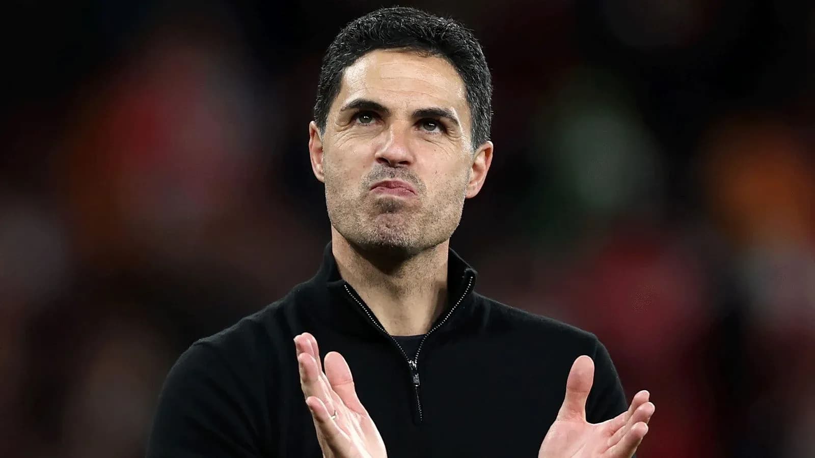 Manager applauding the crowd after a match Manager applauding the crowd after a match