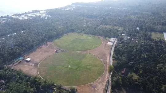Aerial view of two cricket fields surrounded by trees Aerial view of two cricket fields surrounded by trees