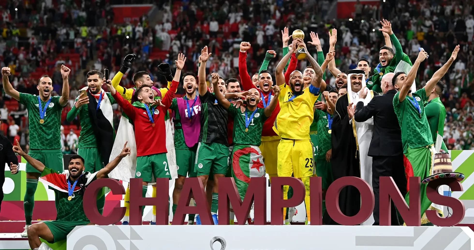 Algerian team celebrating victory with trophy Algerian team celebrating victory with trophy