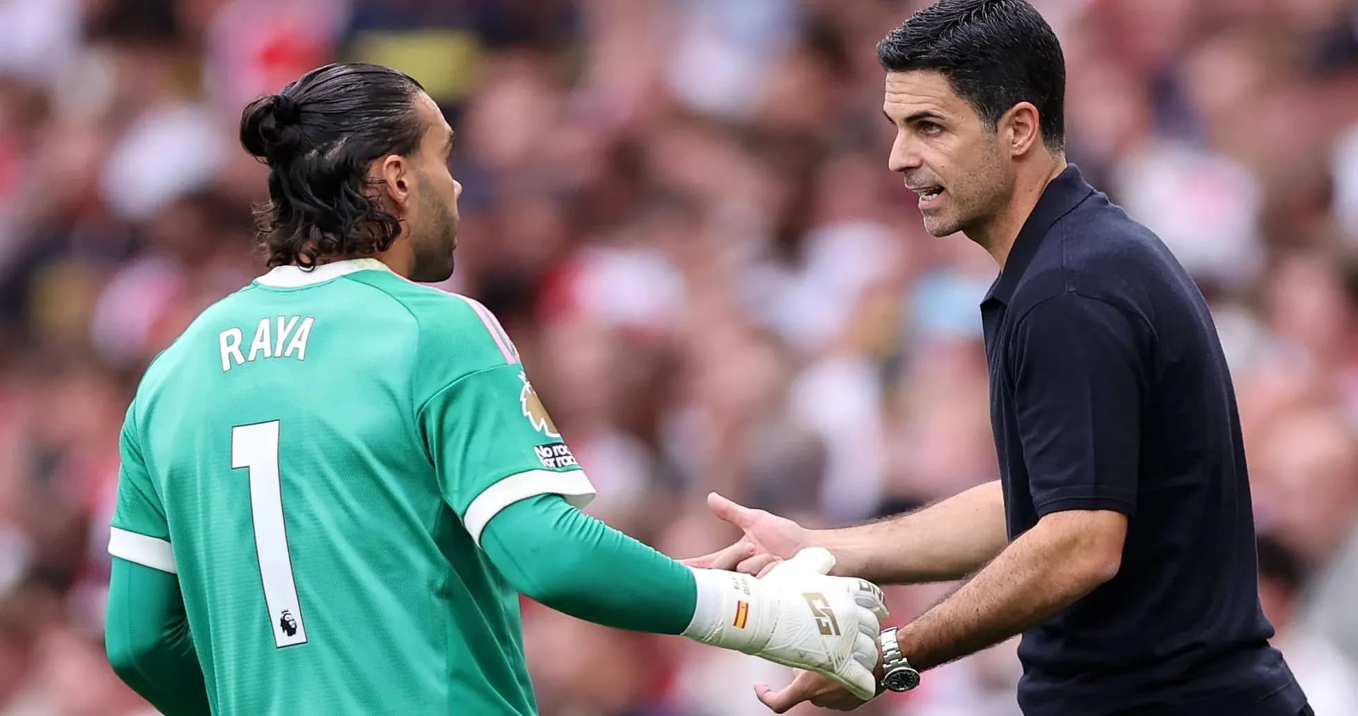 Goalkeeper David Raya and manager Mikel Arteta discussing Goalkeeper David Raya and manager Mikel Arteta discussing
