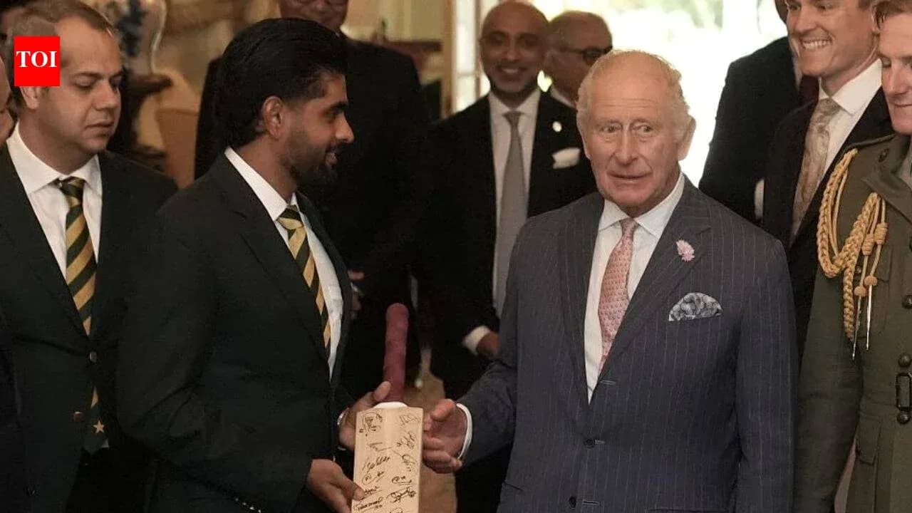 Babar Azam presenting a signed bat to King Charles Babar Azam presenting a signed bat to King Charles