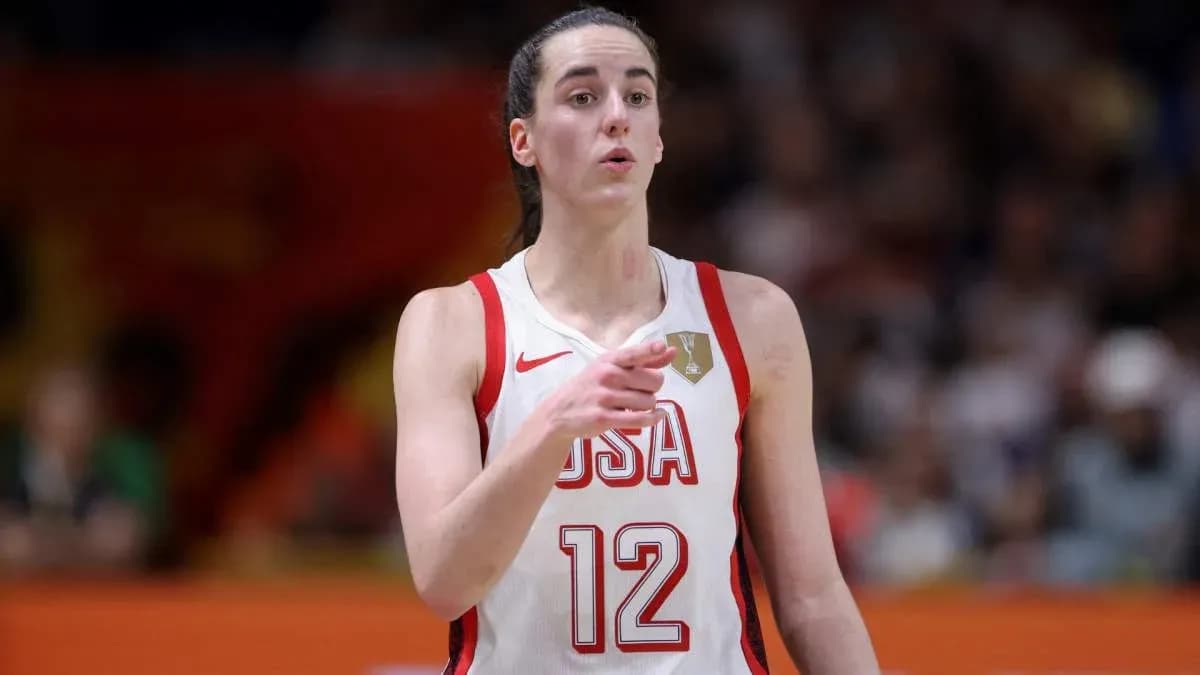 Player in USA jersey signaling during basketball game Player in USA jersey signaling during basketball game