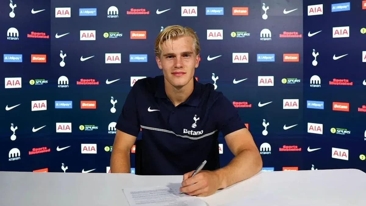 Player signing contract at Tottenham press conference Player signing contract at Tottenham press conference