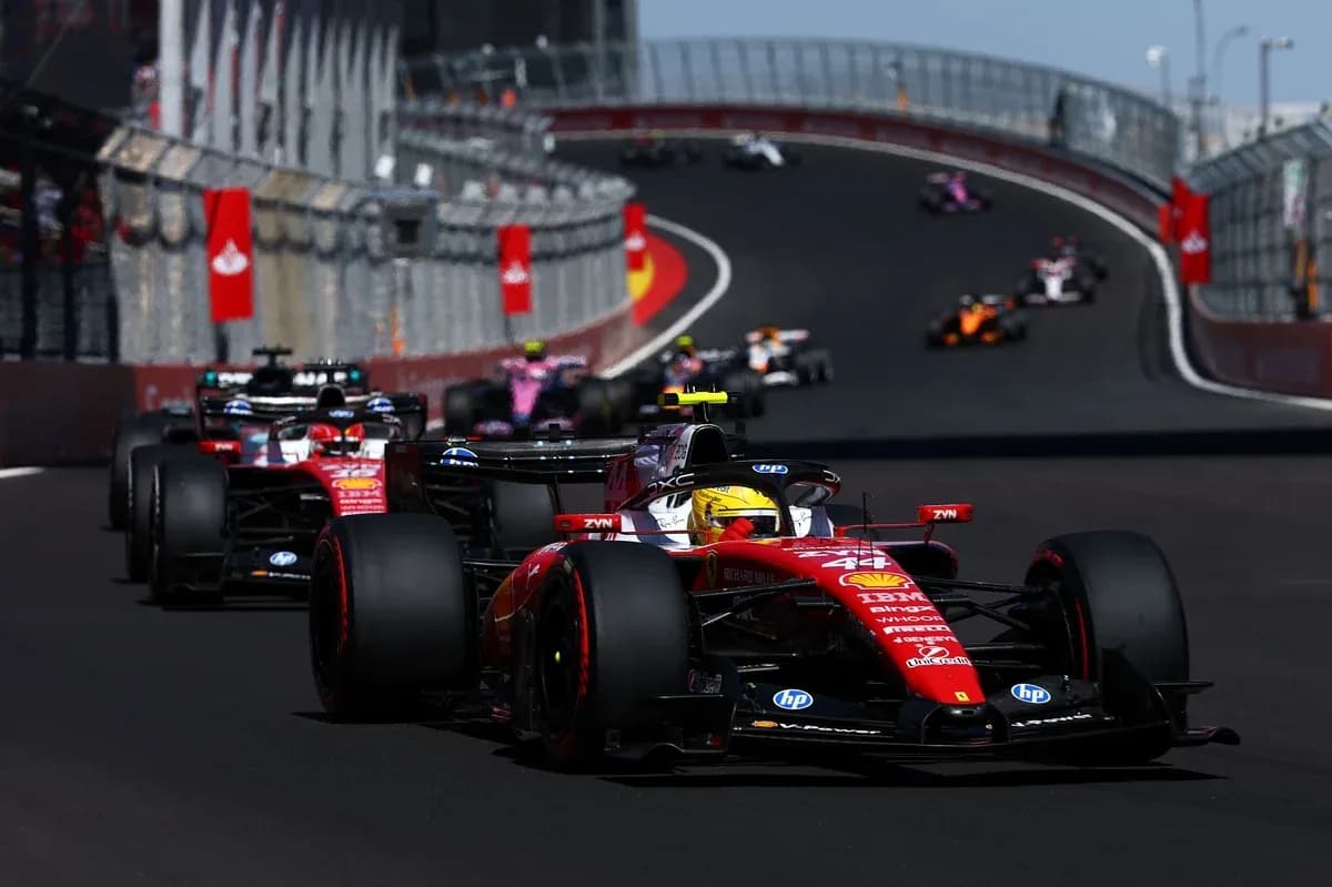 Ferrari car leading a Formula 1 race on track Ferrari car leading a Formula 1 race on track
