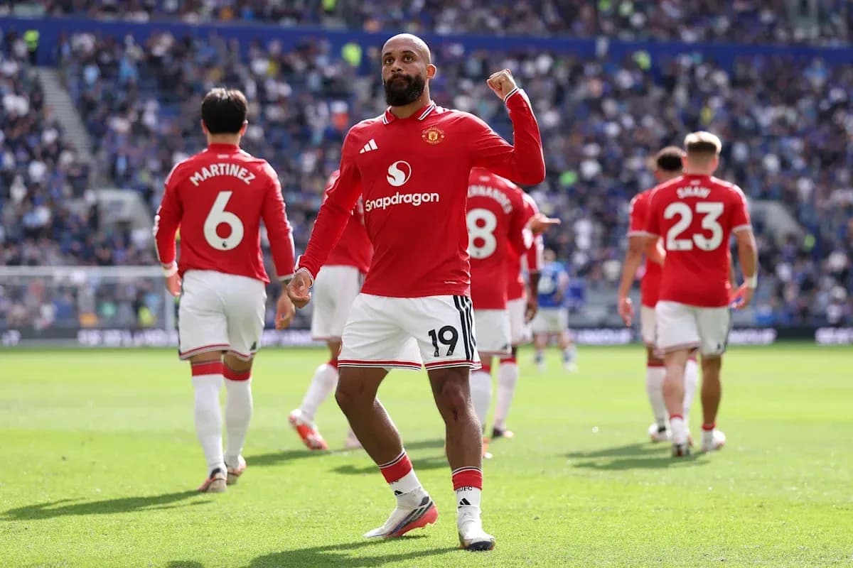 Manchester United player celebrating on the field Manchester United player celebrating on the field