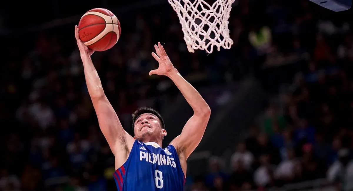 Player jumping to score during basketball game Player jumping to score during basketball game
