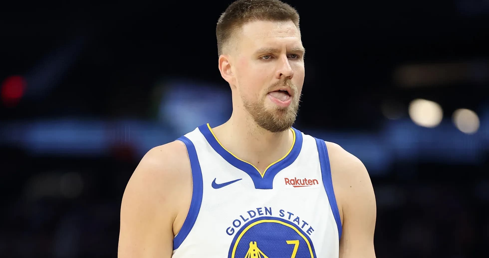 Player in Golden State Warriors jersey on court Player in Golden State Warriors jersey on court