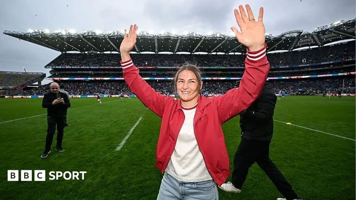 Woman celebrating on the field at a stadium Woman celebrating on the field at a stadium