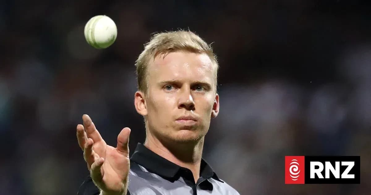 Umpire preparing to deliver a cricket ball Umpire preparing to deliver a cricket ball