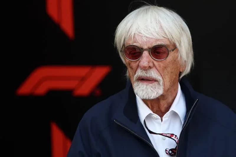 Man with white hair wearing sunglasses at event Man with white hair wearing sunglasses at event
