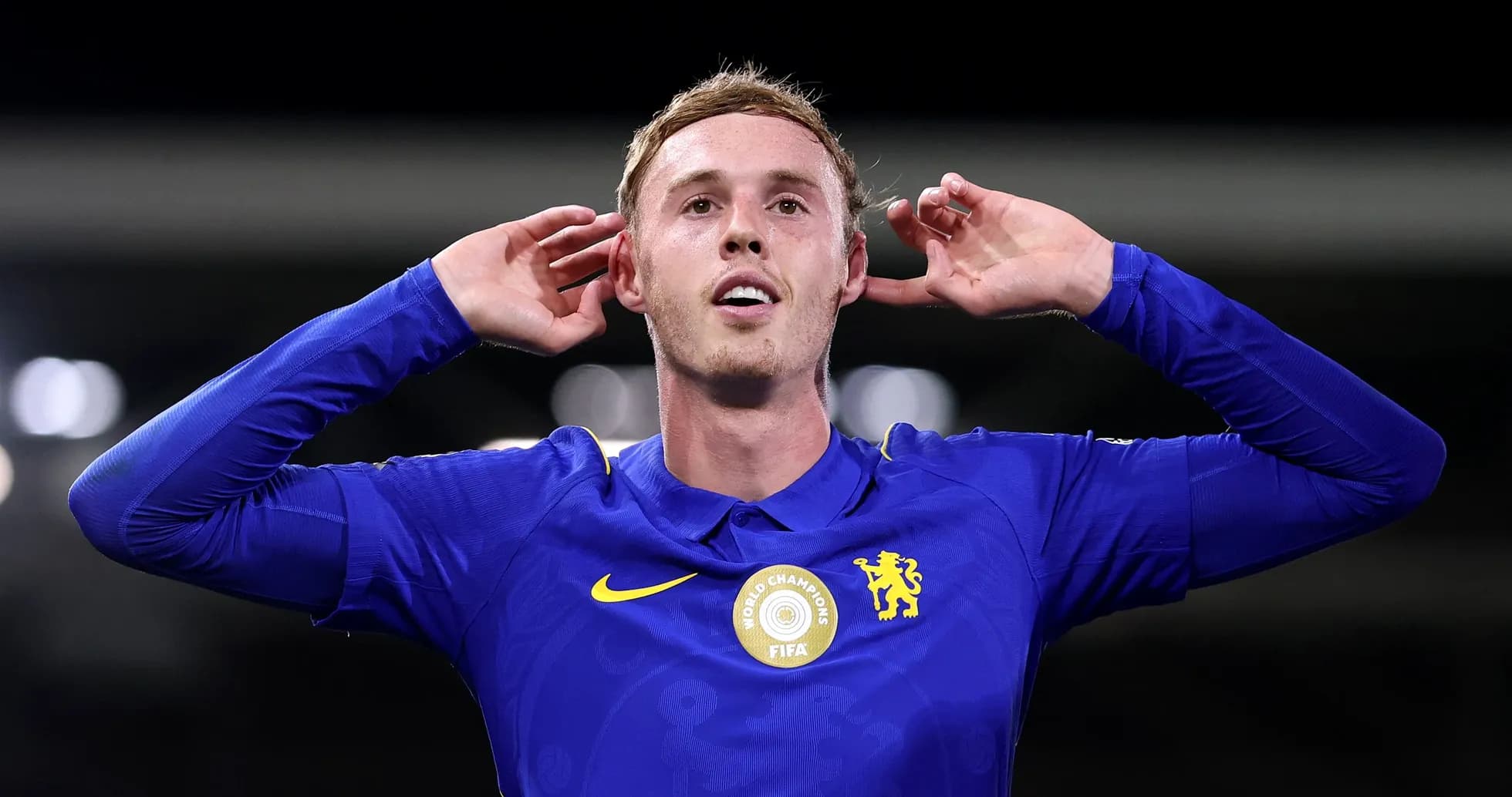 Player celebrating a goal with hands to ears Player celebrating a goal with hands to ears