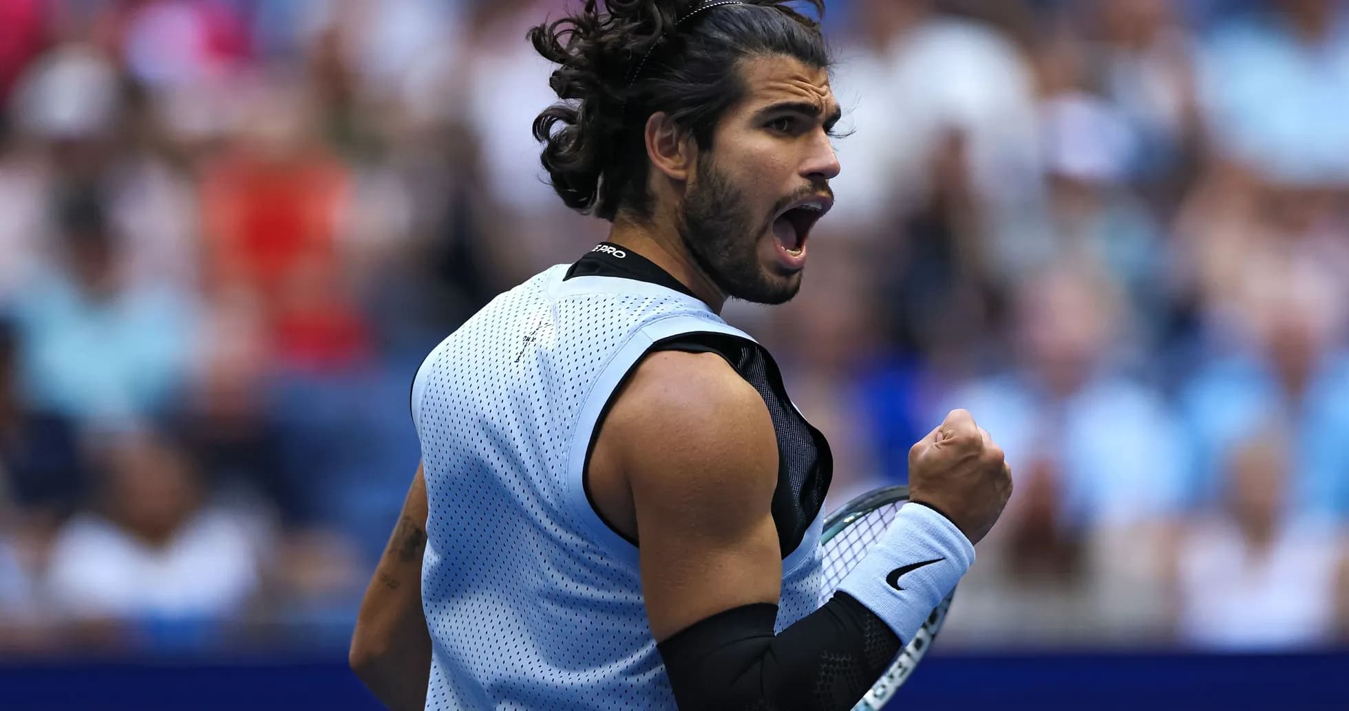 Tennis player celebrating a point during match Tennis player celebrating a point during match