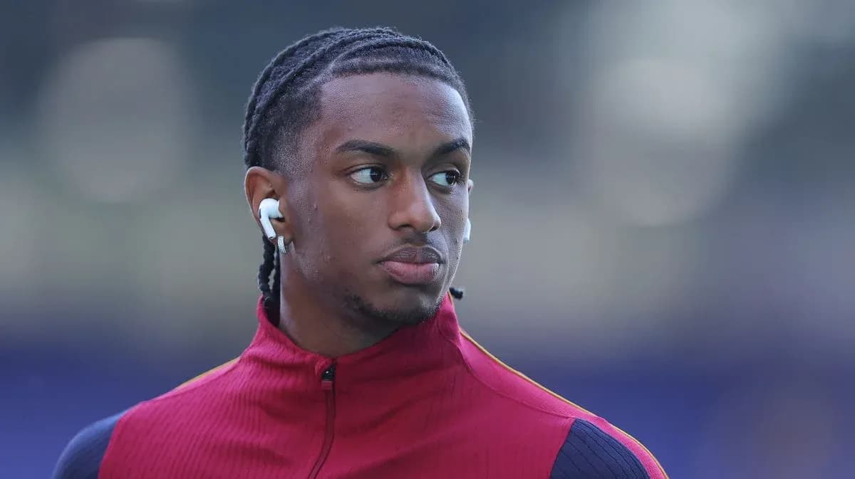 Player wearing red training jacket with earbuds Player wearing red training jacket with earbuds