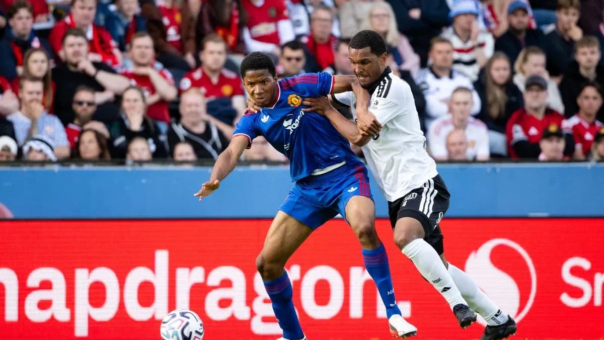 Two players contesting the ball during a match Two players contesting the ball during a match