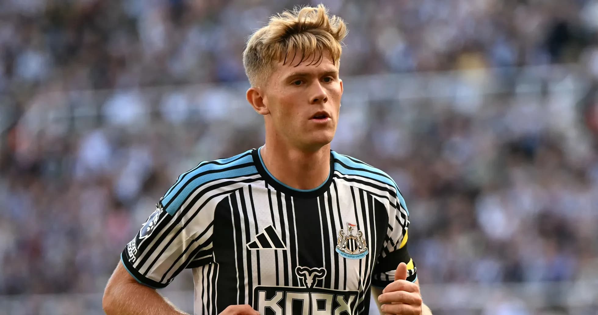 Newcastle player in black and white striped jersey Newcastle player in black and white striped jersey
