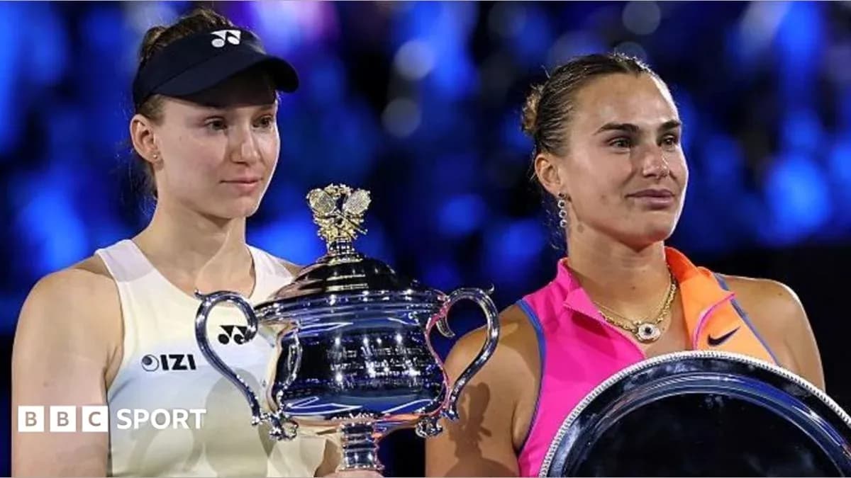 Two tennis players holding trophies after final match Two tennis players holding trophies after final match