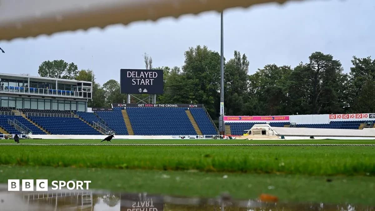 Cricket ground with delayed start sign displayed Cricket ground with delayed start sign displayed