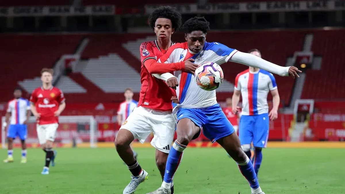 Players contesting possession during a football match Players contesting possession during a football match