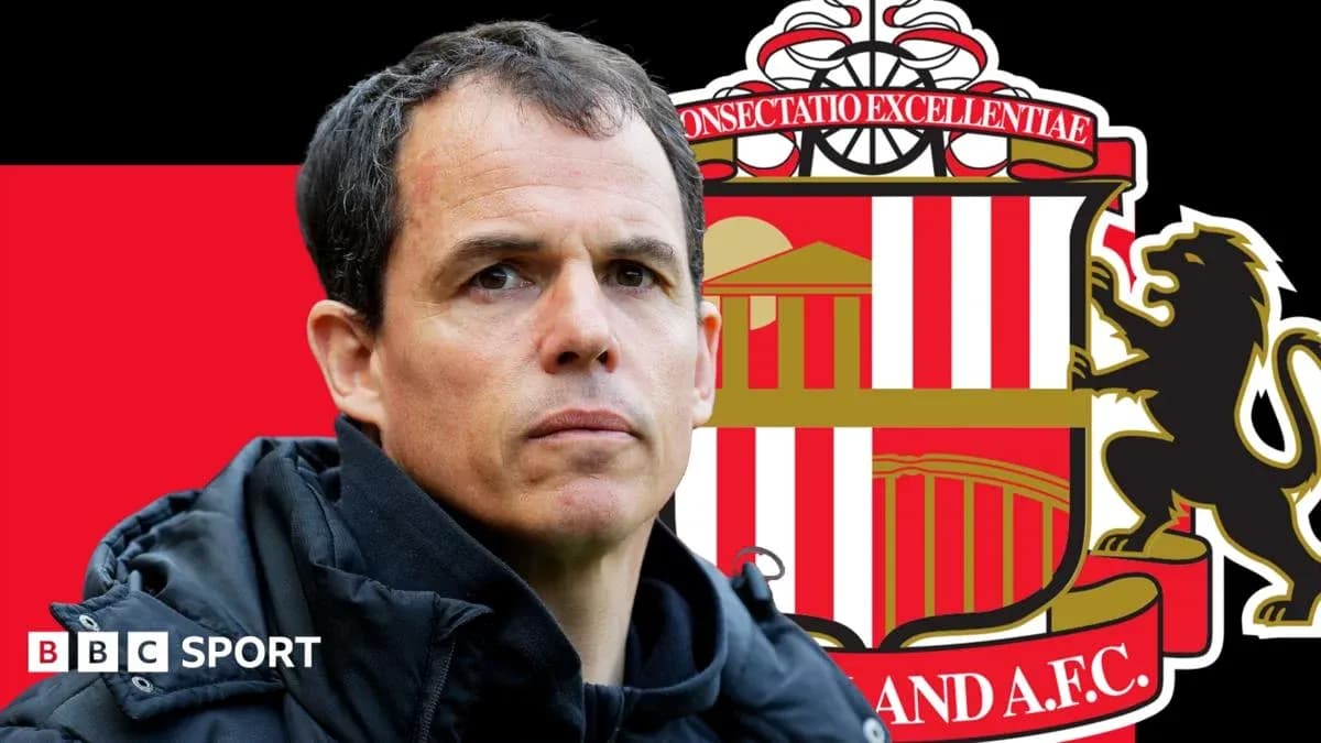 Coach in front of Sunderland A.F.C. logo background Coach in front of Sunderland A.F.C. logo background