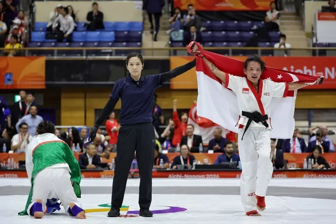 Athlete celebrating victory with national flag at competition Athlete celebrating victory with national flag at competition