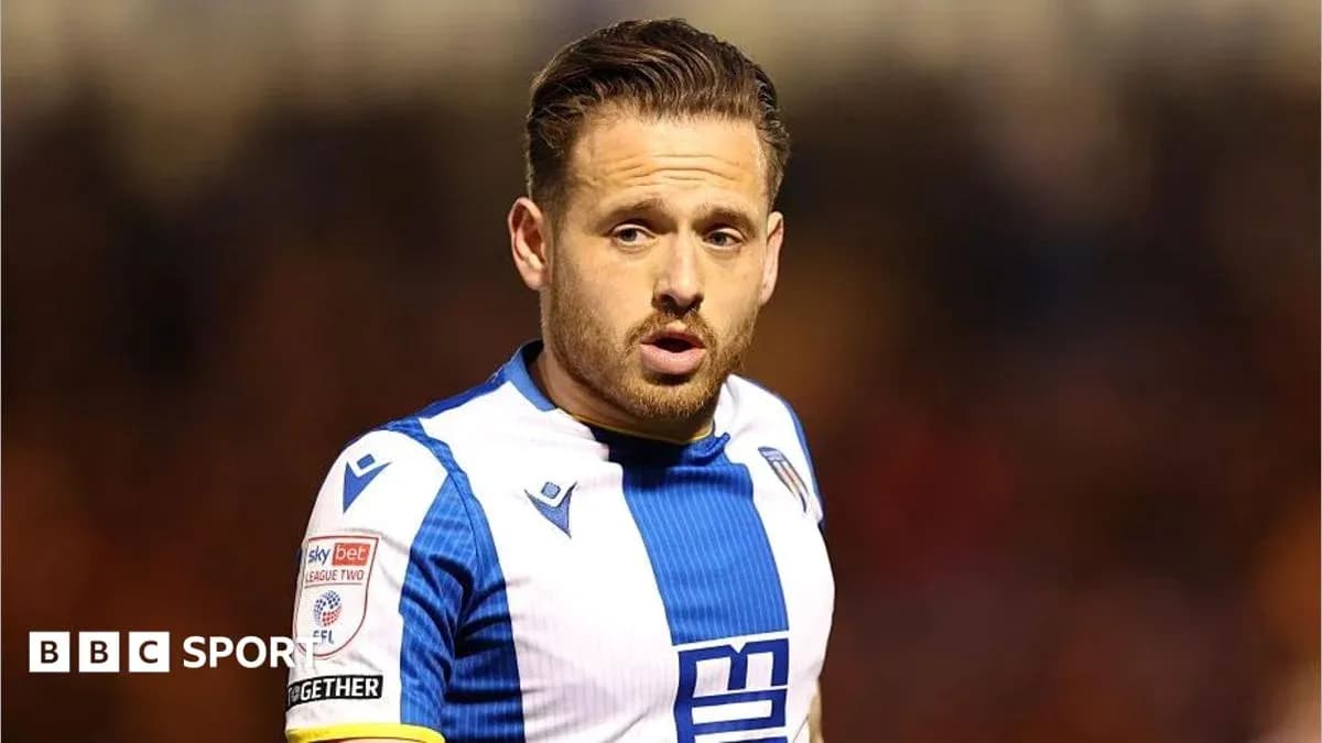 Player in blue and white kit during match Player in blue and white kit during match