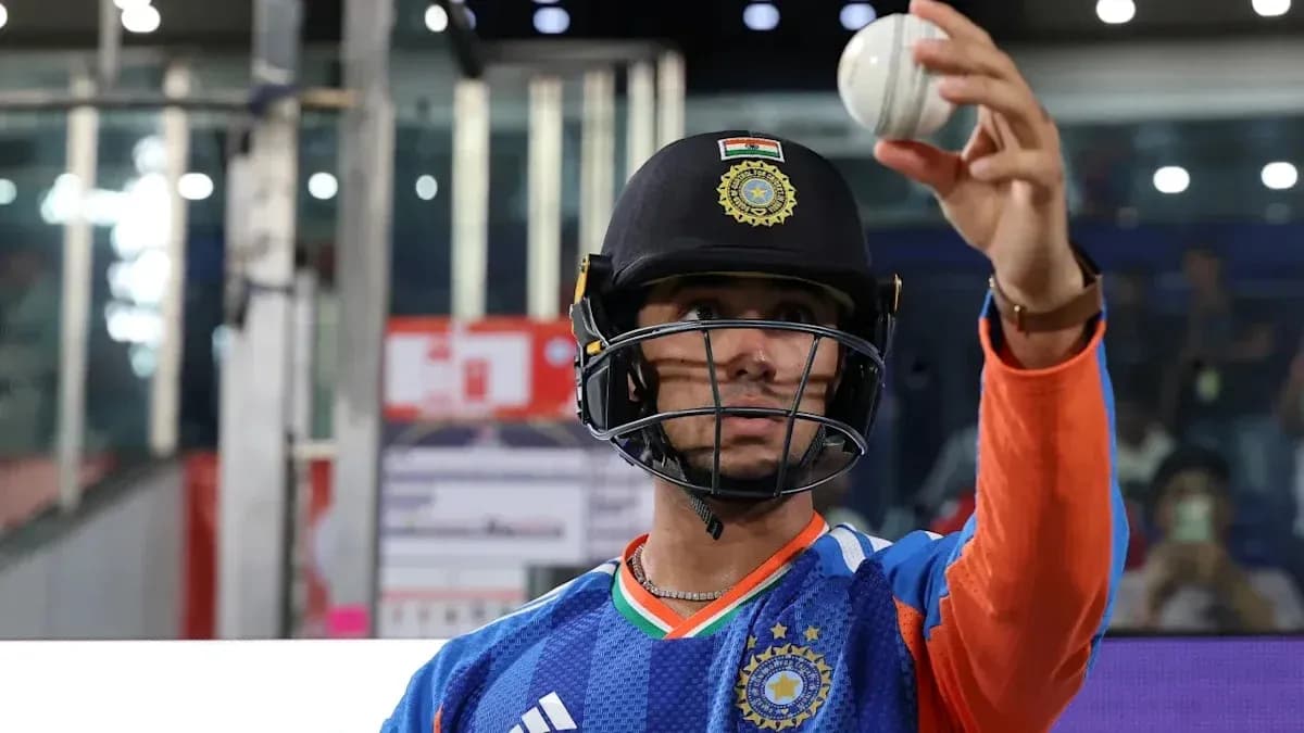 Cricketer holding a ball during practice session Cricketer holding a ball during practice session