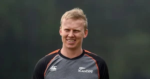 Cricketer in Blackcaps training gear smiling outdoors Cricketer in Blackcaps training gear smiling outdoors
