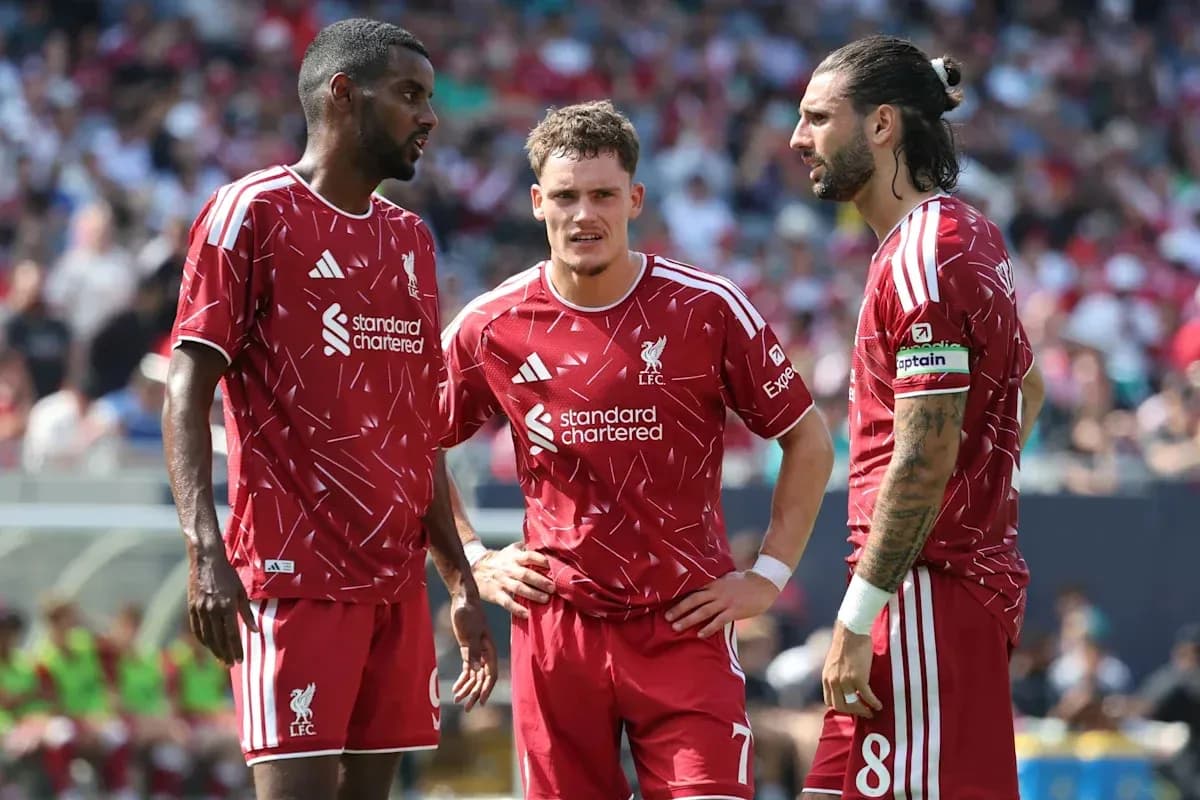 Three Liverpool players discussing during match Three Liverpool players discussing during match