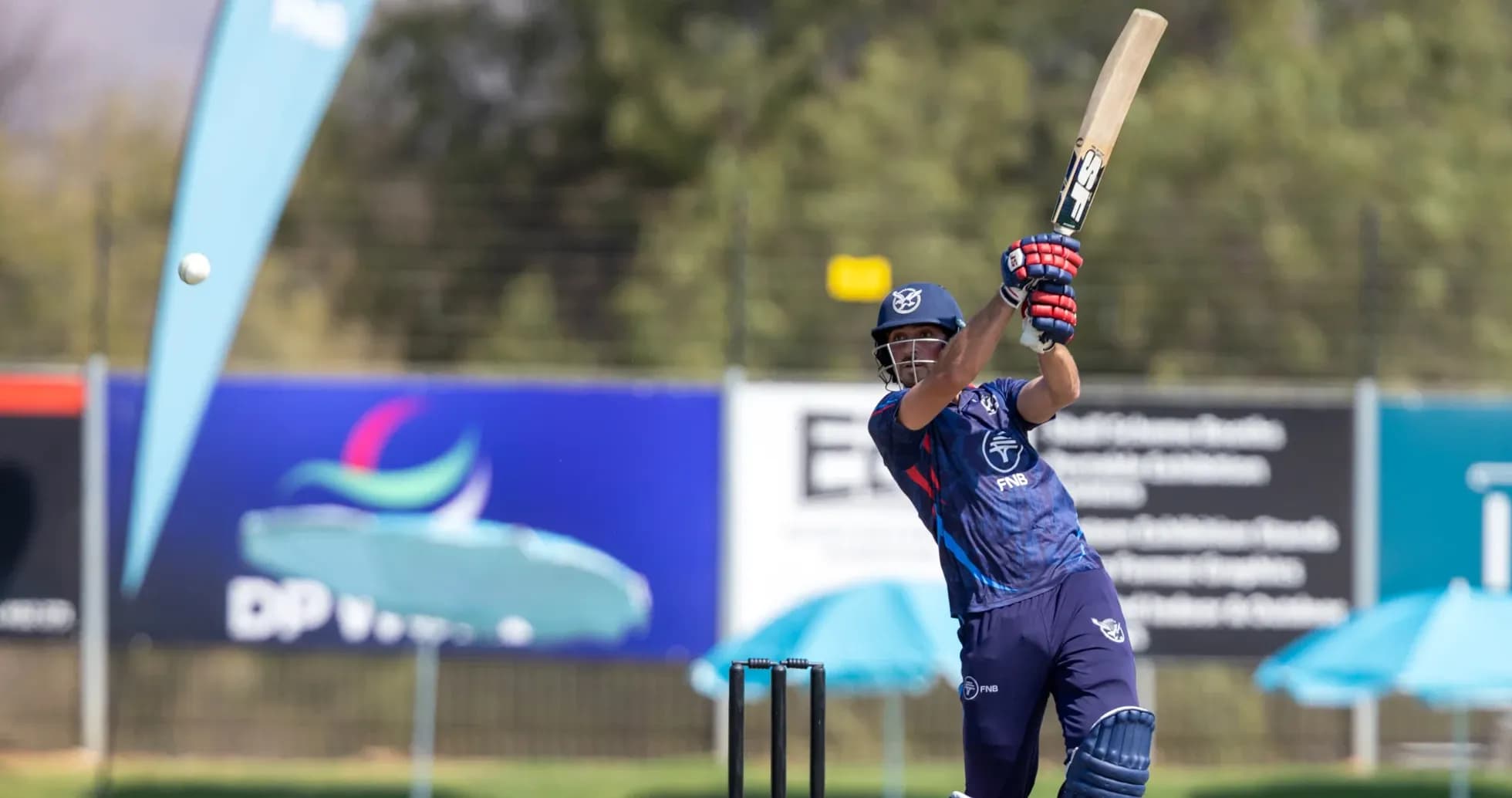 Batsman hitting the ball during cricket practice Batsman hitting the ball during cricket practice