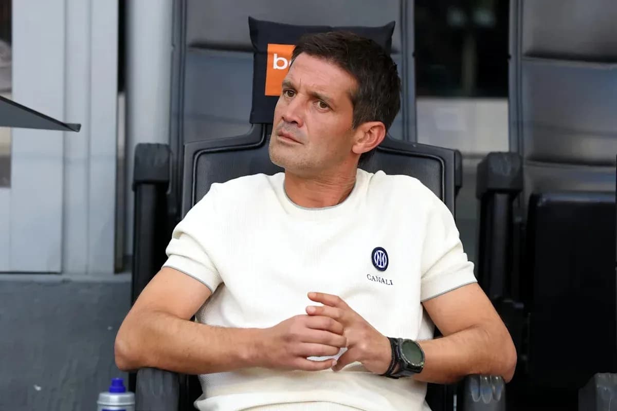 Coach sitting in dugout during match Coach sitting in dugout during match