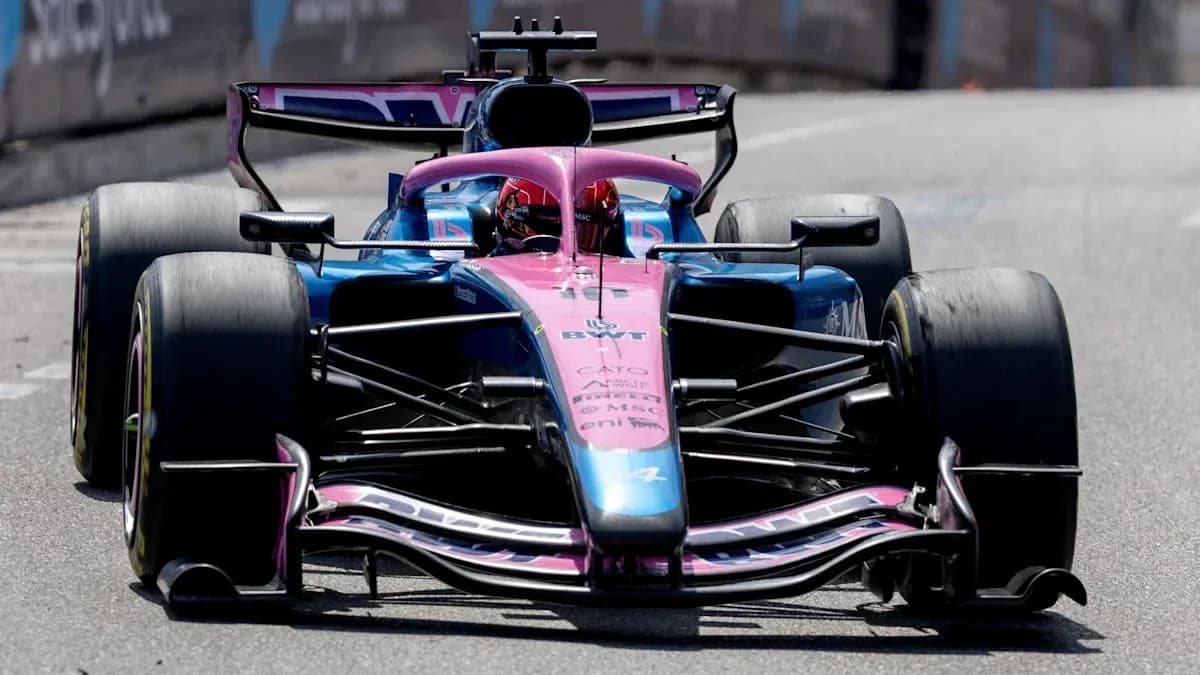 Racing car in motion during Formula 1 event Racing car in motion during Formula 1 event
