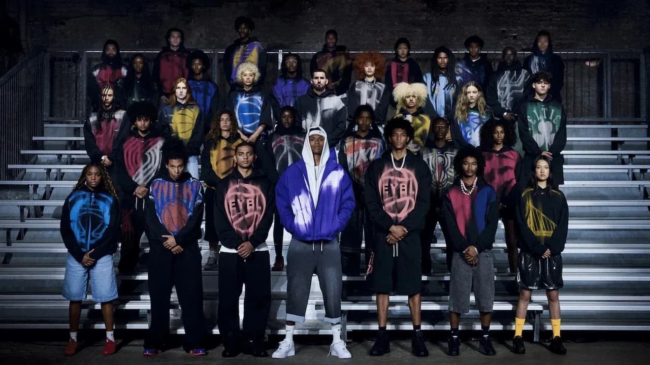 Group of young athletes posing in colorful hoodies Group of young athletes posing in colorful hoodies