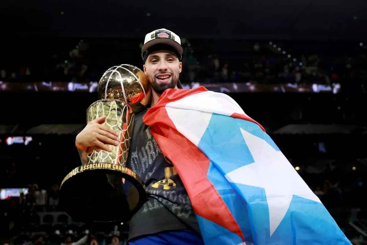 Player holding championship trophy and flag Player holding championship trophy and flag