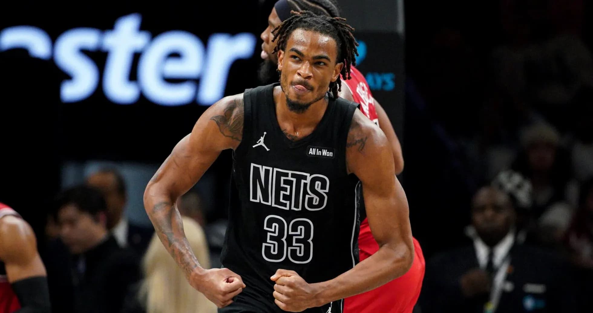Player celebrating during a Brooklyn Nets game Player celebrating during a Brooklyn Nets game