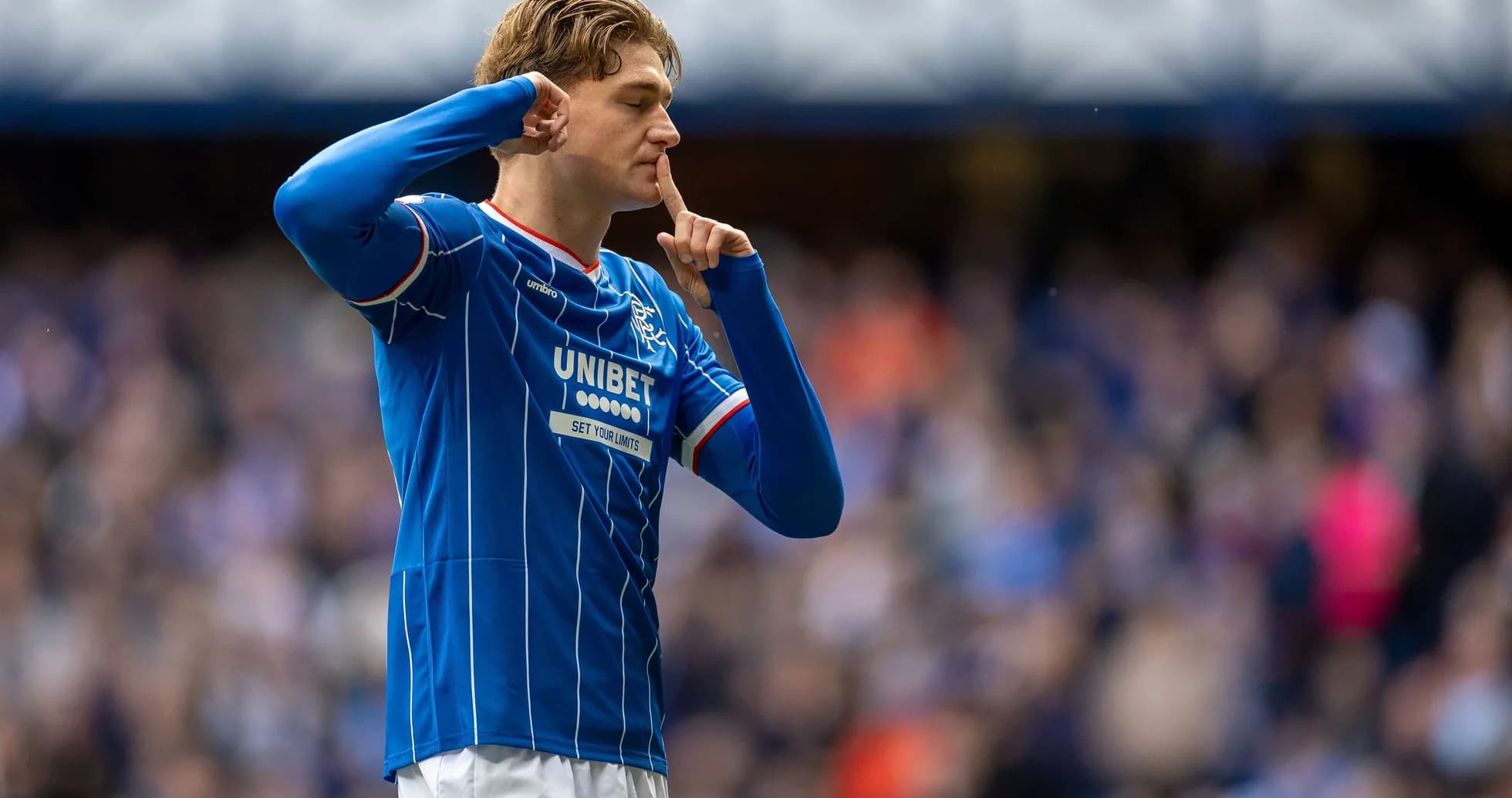 Player celebrating with shushing gesture after scoring Player celebrating with shushing gesture after scoring