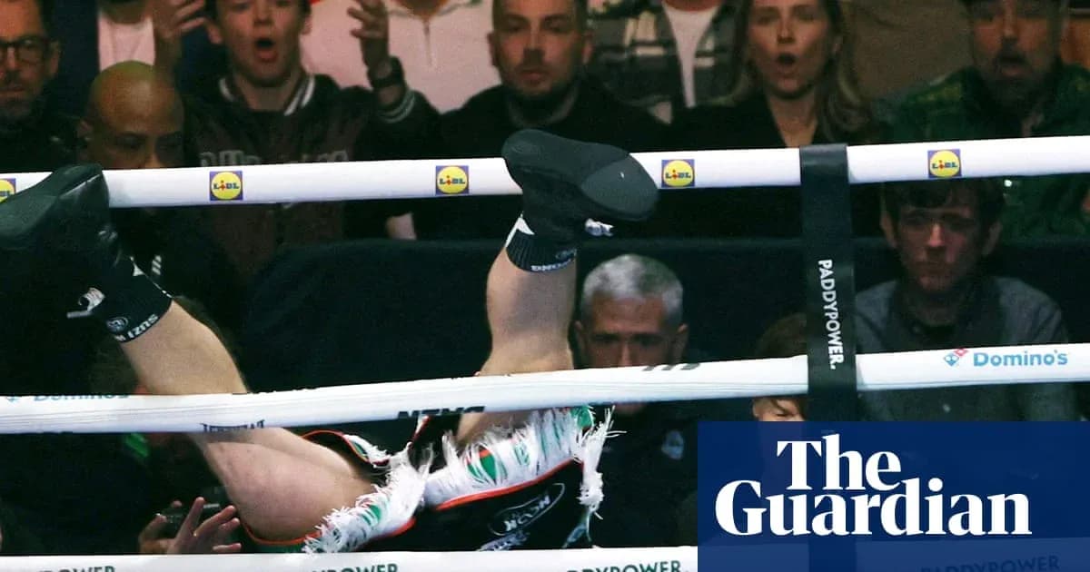 Boxer falling through the ropes during a match Boxer falling through the ropes during a match