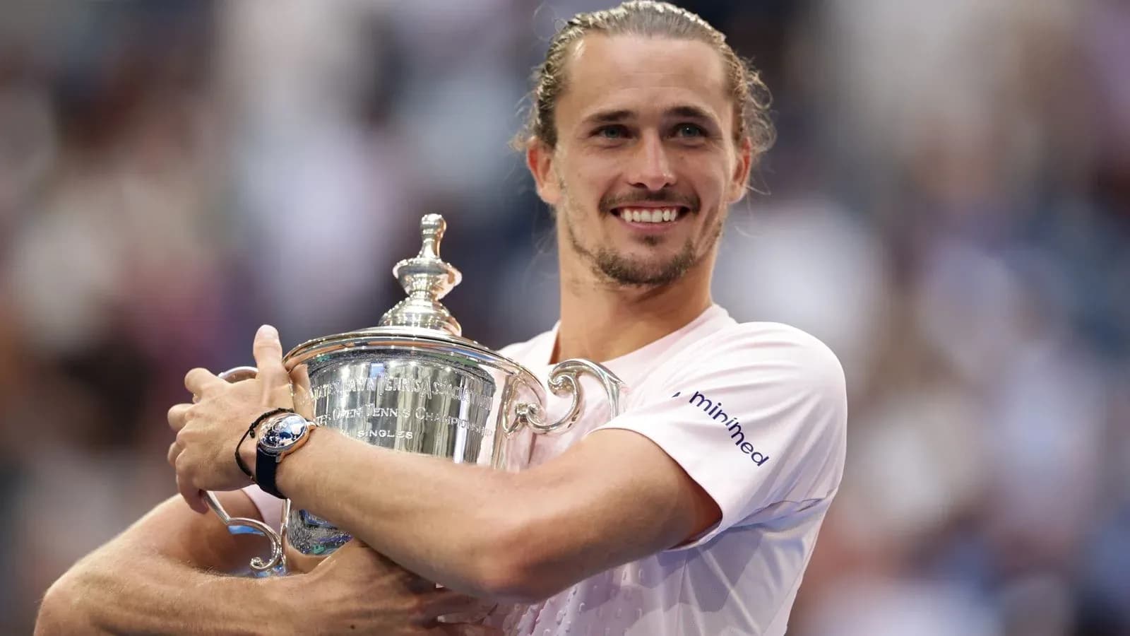 Player celebrating with trophy after tournament victory Player celebrating with trophy after tournament victory