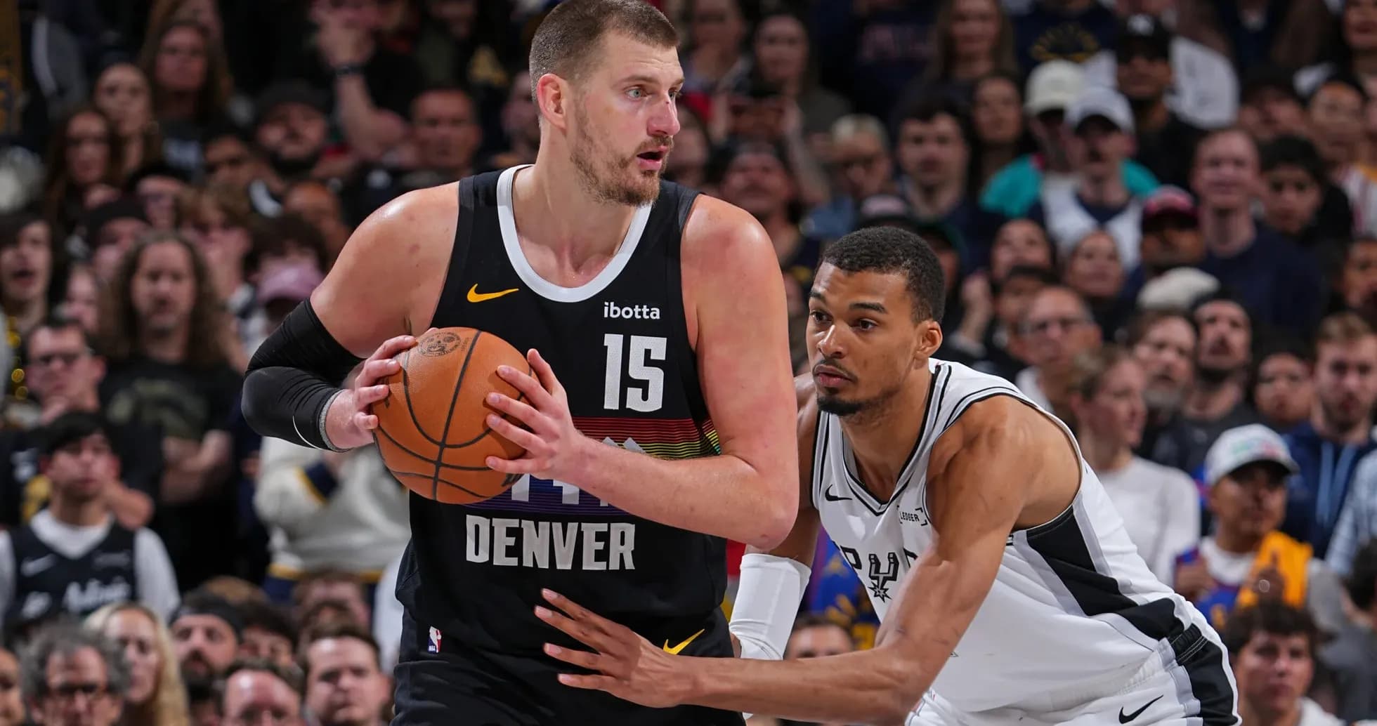 Player dribbling the ball during NBA game action Player dribbling the ball during NBA game action