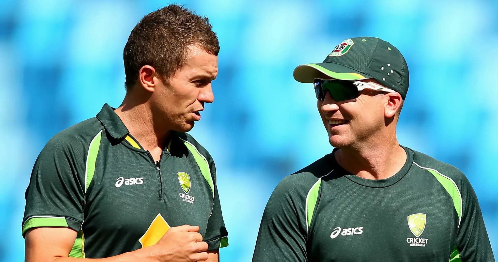 Two Australian cricket players talking during practice Two Australian cricket players talking during practice