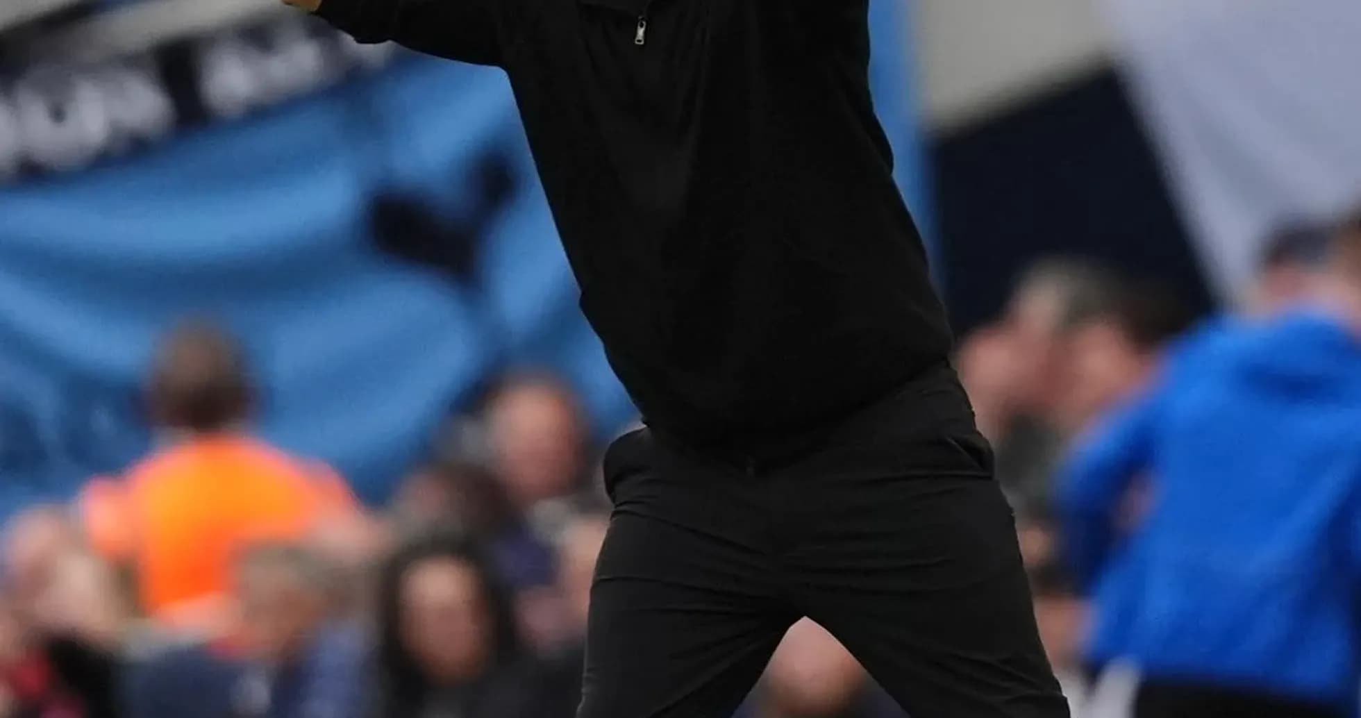 Coach gesturing during a football match on the sidelines Coach gesturing during a football match on the sidelines